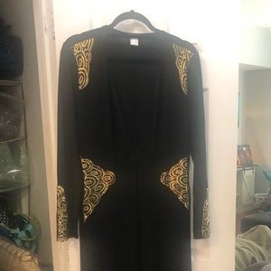 Long sleeve black dress with gold detail